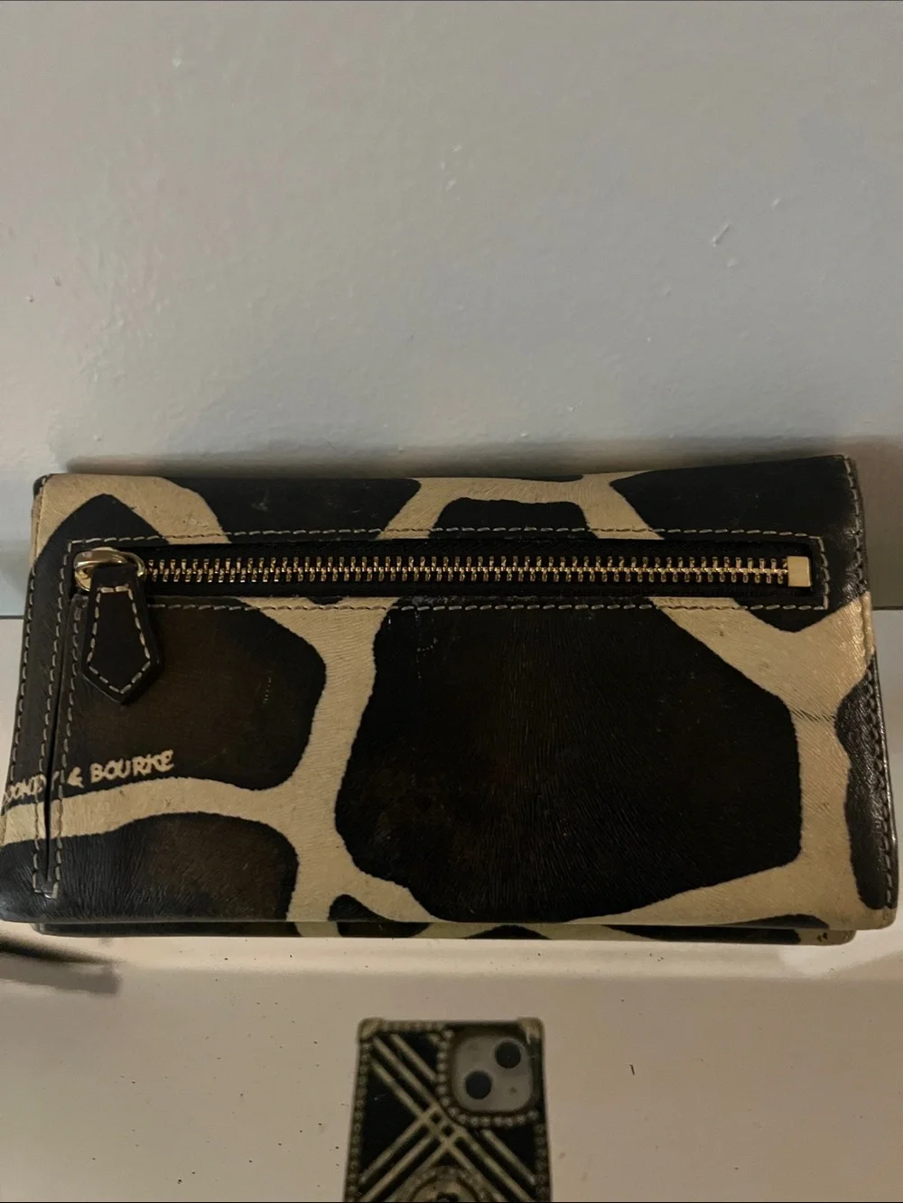 Dooney & Bourke Black and Cream Giraffe-Print Leather Clutch